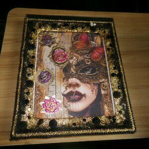 vintage glass buttons & beads hand crafted on a wood glassed frame.